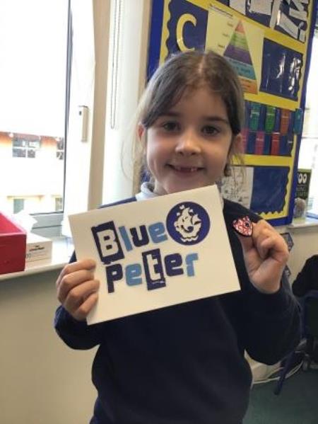 Eleri receives a Blue Peter badge